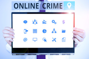 Word writing text Online Crime. Business photo showcasing crime or illegal online activity committed on the Internet Male human holding thick textured cardboard of business promotion concept
