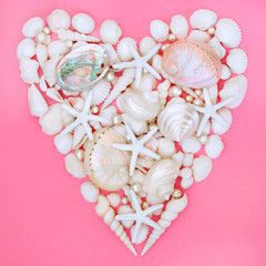 Seashell, starfish and pearl heart with a variety of white shells on pastel pink background,....