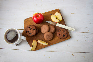 Hot coffee cup. strong coffee on wooden table background. fresh coffee. latte coffee. morning coffee. Coffee with i blocks and chocolate chip cookies. copyspace