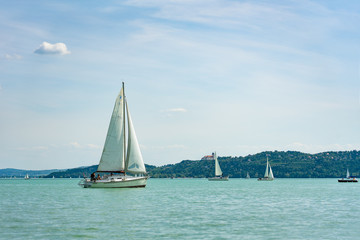 Fototapeta premium sail boat on the lake view of Tihany from Balatonfüred