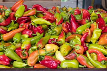 Sweet paprika in a big pile, assorted yellow, green, red, medium