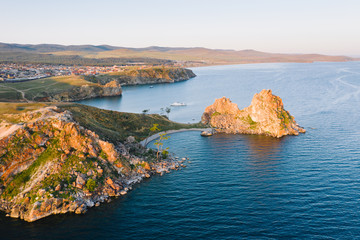 Aerial view of Cape Burhan and Shamanka Rock near the village of Khuzhir at Olkhon Island, Russia. Beautiful natural environment of Baikal Lake on a sunny summer morning