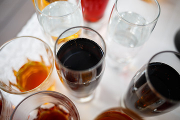 Glass glasses with drinks stand on a table
