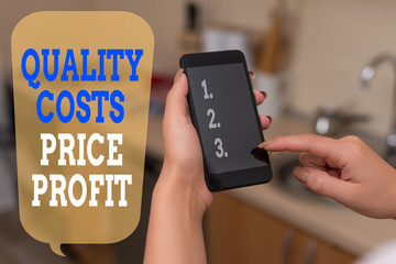 Writing note showing Quality Costs Price Profit. Business concept for Balance between wothiness earnings value woman using smartphone and technological devices inside the home