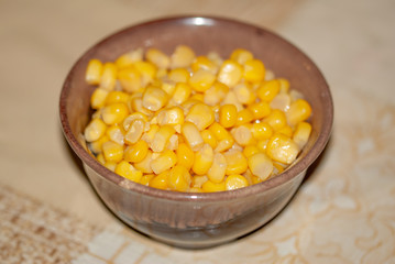 Sweet corn in a brown bowl on the holiday table