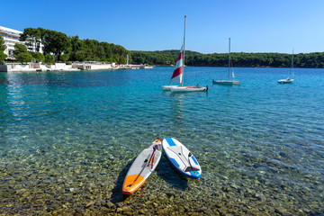 2 sub boards paddleboards on the crystal clear water sea in croatia