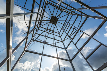 Antennas of military radio station are on the roof and blue sky as a background.