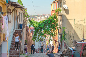 Narrow streets with low colorful houses. Mediterranean style. Middle Eastern flavor. Historical concept. Hipster background. Facades of buildings decorated in boho style. Turkey, Istanbul