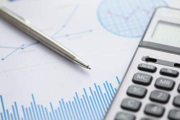 Pen lie on blue financial statistic analisys chart. Business education concept. Fast banking credit loan