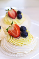 Tasty merenga dessert on light background