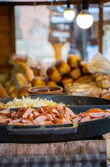 Traditional food festival pan full of sausage