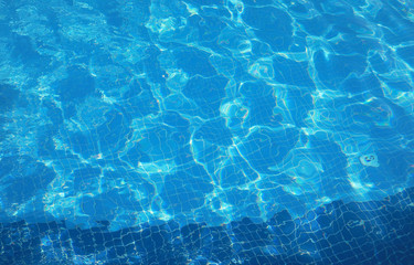 surface of blue swimming pool,background of water in swimming pool.