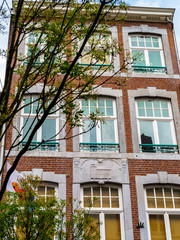 Beautiful old building in Maastricht, Netherlands, exterior facade partial view