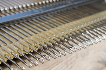 knitting machine for knitting at home. hooks, close-up.