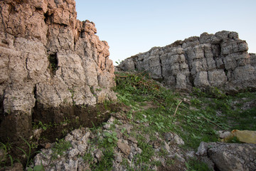 Fototapeta premium The curb erosion from storms. To indicate the layers of soil and rock.