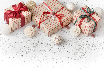 New year white festive background with gift tied with red ribbon.