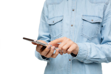 Interested female using smartphone over white background