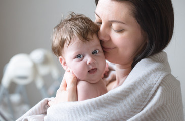portrait of mom with cute little newborn girl.