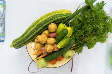 various vegetables on a white tablecloth close-up