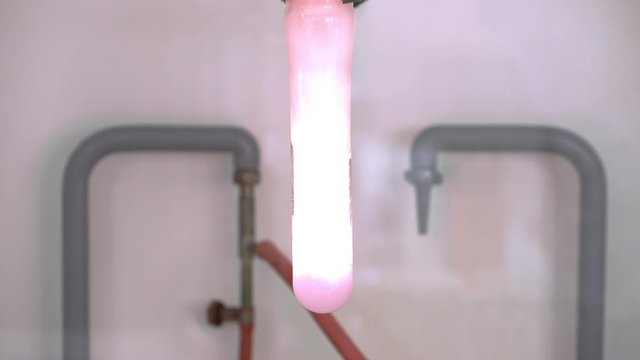 Chemical reaction of a gummy bear thrown into liquid potassium chlorate
