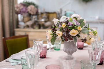 bouquet of flowers in a vase at the wedding table