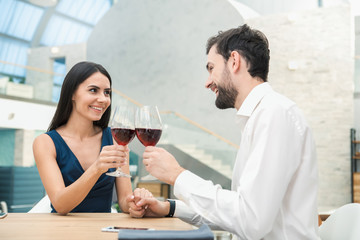 Young Man and Woman Sitting in the Restaurant Concept