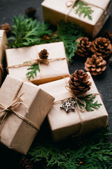 Christmas, New Year, winter holidays concept and celebration mood. Presents delivery, online sale. Festive decorated gift boxes on dark background