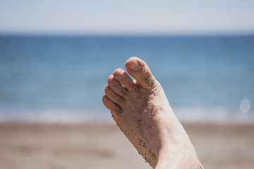 Sandy feet at beach