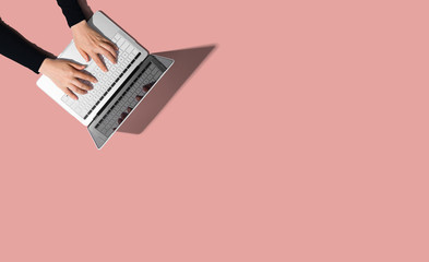 Person using a laptop computer from above