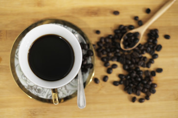 Good morning with a classic cup of coffee on wooden background