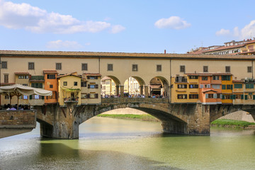 Fototapeta na wymiar Ponte Vecchio in Florence, Italy. Ancient Bridge over the Arno River in one of Tuscany's biggest Tourist Attractions