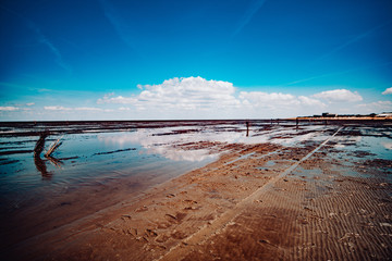 The North Sea mud flat reflecting Sky in Cuxhaven