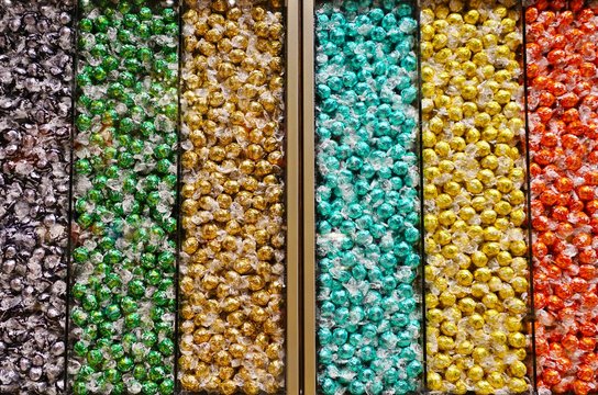 NEW YORK CITY, NY -4 OCT 2019- View of lots of Lindt truffle chocolate balls wrapped in colorful foil for sale at a Lindt candy store in New York.