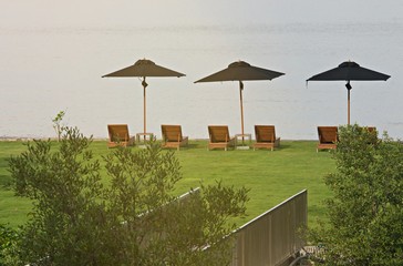 Landscape of Umbrella and beach bed around private zone on the beach in hotel and resort, Holiday Vacation concept