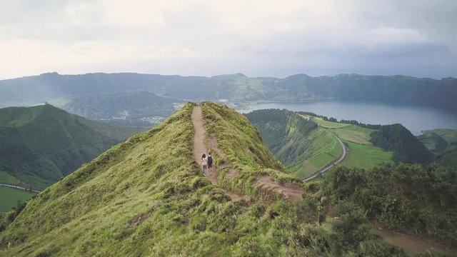 Hikers Walk Road to Miradouro da Grota do Inferno