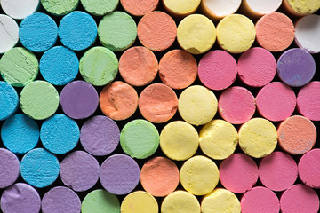 rows of multicolor chalks stick background