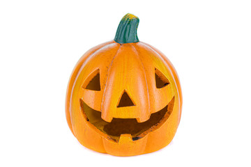 Ceramic orange pumpkin with eyes, nose and isolated mouth on a white background.