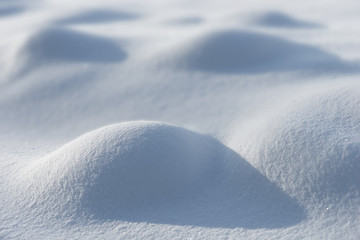 smooth snow surface with small bumps on sunny winter day