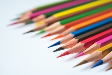 rows of multicolor pencil on white background