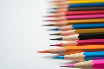 rows of multicolor pencil on white background