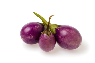Closeup image of purple small thailand egglants group isolated at white background. Healthy vegan vegetable diet concept.