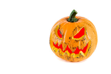Big orange pumpkin with eyes and mouth with red light, isolated on a white background.
