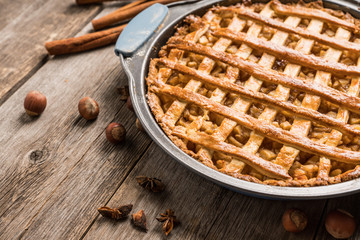 Freshly baked autumn apple pie with cinnamon. Selecive focus. Shallow depth of field.