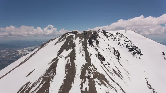Cascade Mountains, California circa-2019.  Aerial view of Lassen Peak.  Shot from helicopter with Cineflex gimbal and RED 8K camera.