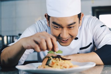man and woman eating pizza in kitchen