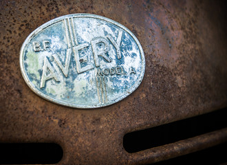 BF Avery Model A Emblem on rusted tractor hood