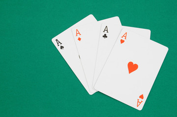 Playing cards on green table