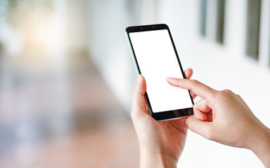 Closeup of girl hand holding and using smartphone online