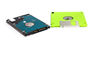 The difference between storage devices. Old technology of floppy disk and new technology of hard disk. isolated on white