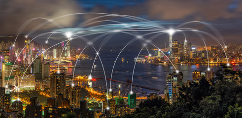 Technology Connection line between Panorama Hong Kong Cityscape skyscraper at twilight time, Hong Kong central and Kowloon island, data cloud computer and internet of things concept